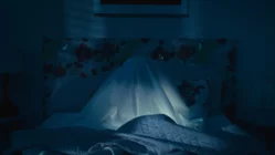 Scene from It Listens 2022 showing a smart speaker hiding dark secrets