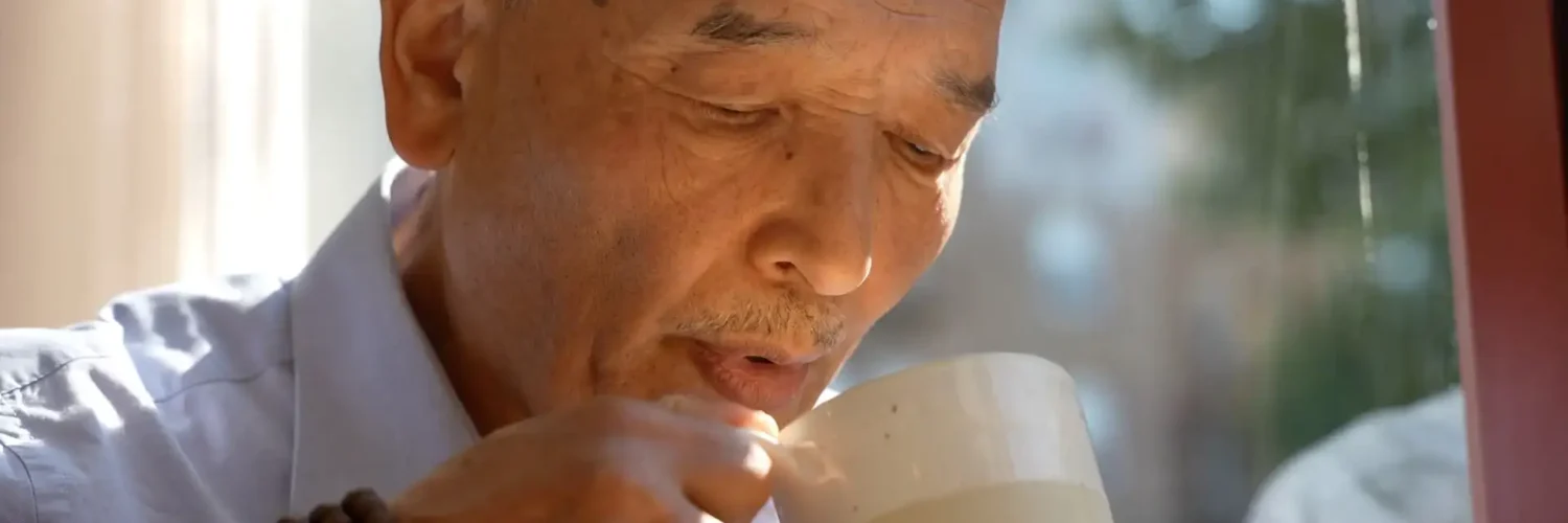Butter Tea Tibetan short film scene showing traditional Losar butter tea preparation in Tibetan home