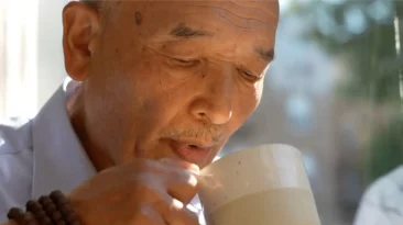 Butter Tea Tibetan short film scene showing traditional Losar butter tea preparation in Tibetan home